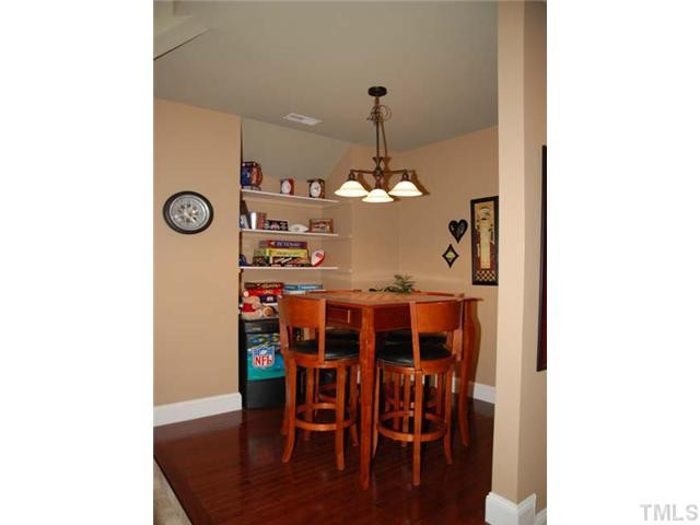1005 Farnsworth Road Wake Forest, NC 27587 - Photo 17 of 25 The terrific bonus room with game area has skylights and a built in entertainment center. Bonus Room
