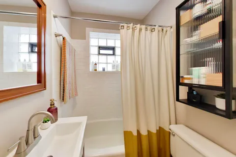 a bathroom with a bathtub and a sink