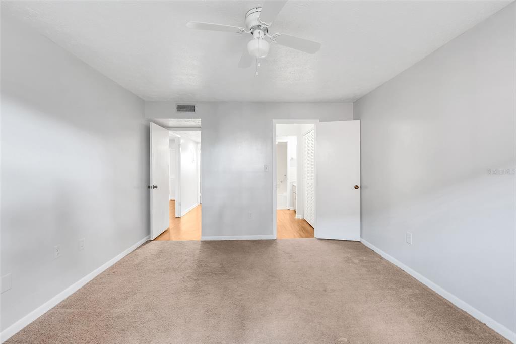 4212 Lake Underhill Road, Unit A Orlando, FL 32803 - Photo 18 of 35 a view of an empty room with a ceiling fan