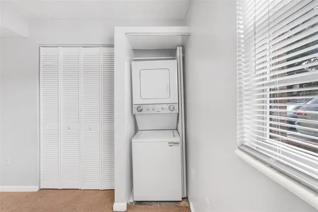 a utility room with a sink dryer and washer