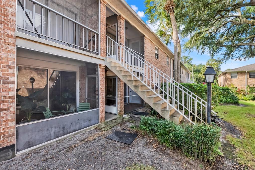 4212 Lake Underhill Road, Unit A Orlando, FL 32803 - Photo 31 of 35 a view of a house with backyard and porch
