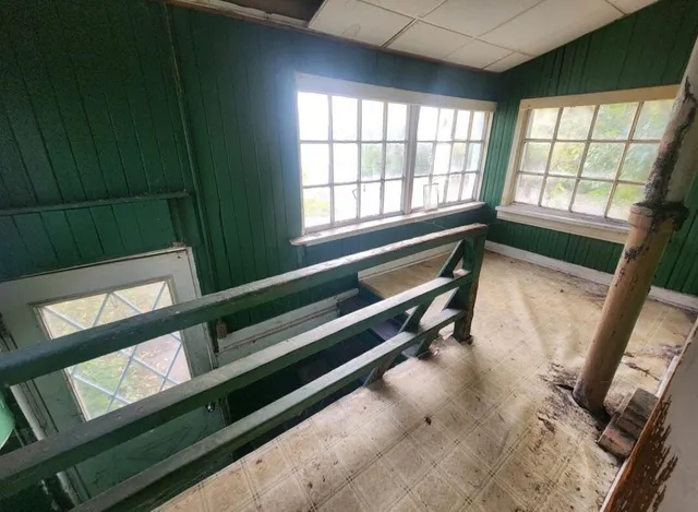 an empty room with windows