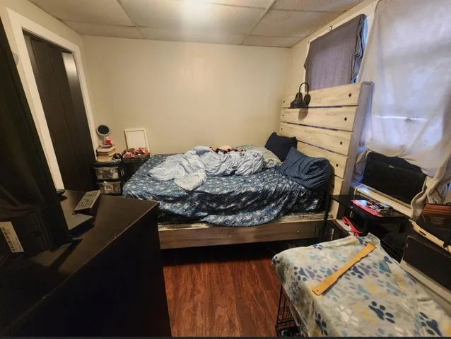 a bathroom with a sink and mirror with toilet
