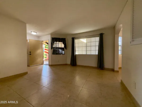 a view of empty room with a window