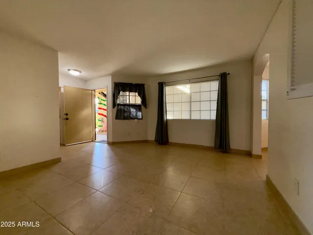 a view of empty room with a window