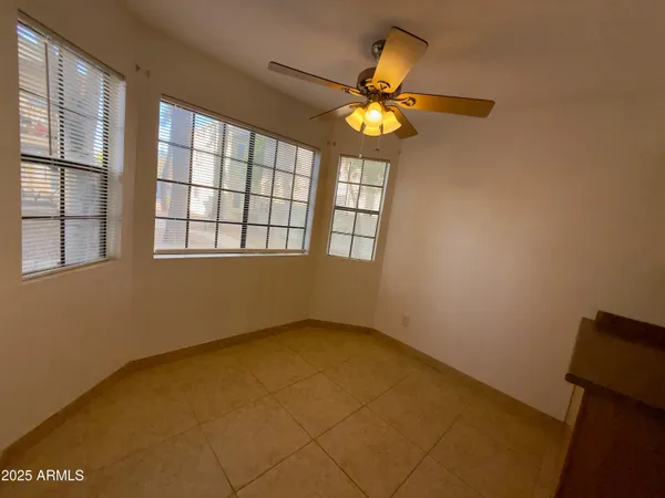a kitchen with a refrigerator and a sink