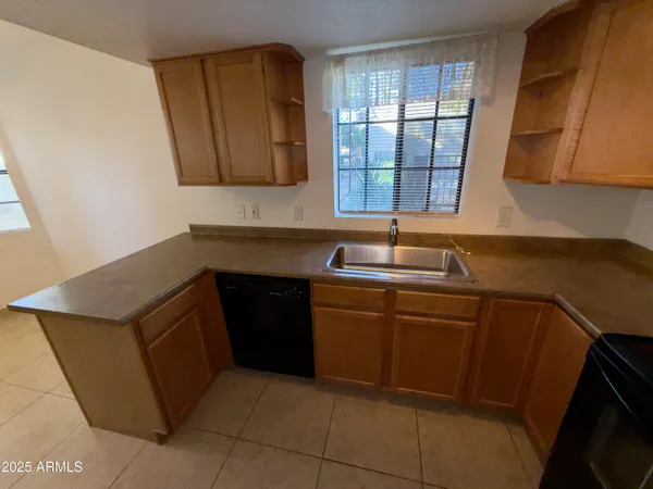a bathroom with a sink and a window