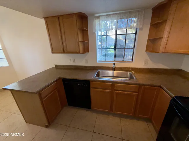 a bathroom with a sink and a window