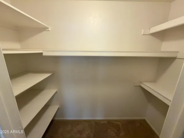 a view of an empty walk in closet
