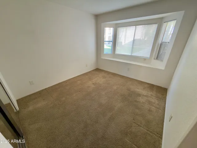 a view of a street in front of a brick building