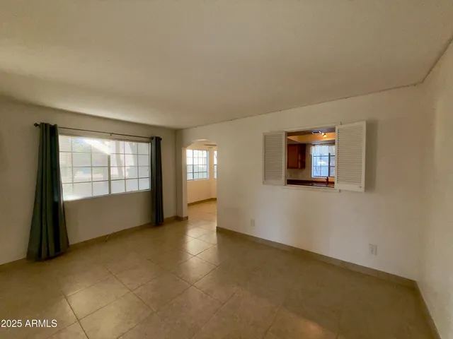 an empty room with windows