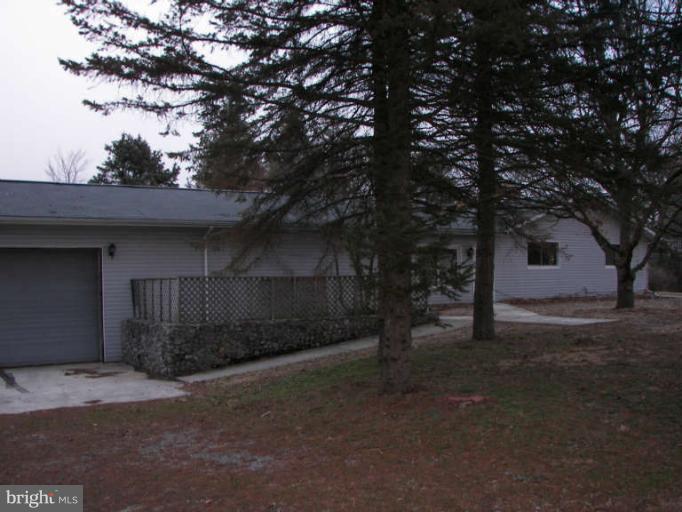 472 Sherrill Berkeley Springs Berkeley Springs, WV 25411 - Photo 2 of 18 a view of a house with a yard