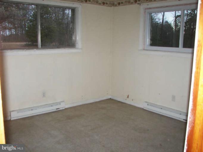 472 Sherrill Berkeley Springs Berkeley Springs, WV 25411 - Photo 14 of 18 an empty room with a window