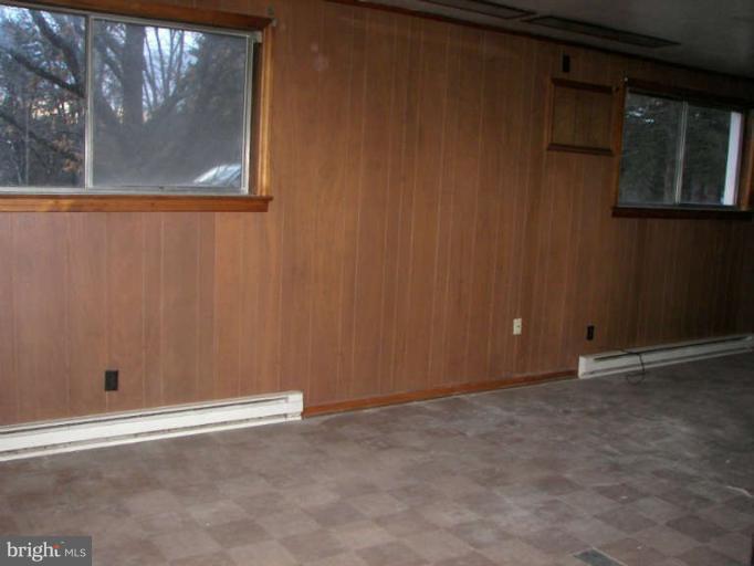 472 Sherrill Berkeley Springs Berkeley Springs, WV 25411 - Photo 6 of 18 a view of an empty room with a window