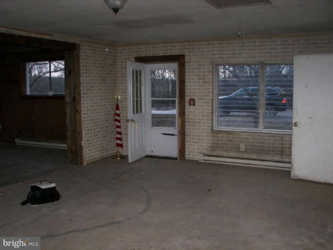 472 Sherrill Berkeley Springs Berkeley Springs, WV 25411 - Photo 8 of 18 a view of empty room with windows