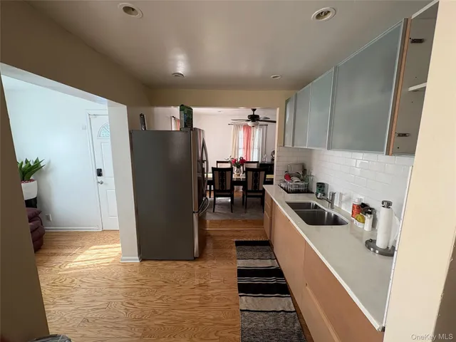 a kitchen with stainless steel appliances a refrigerator and a sink