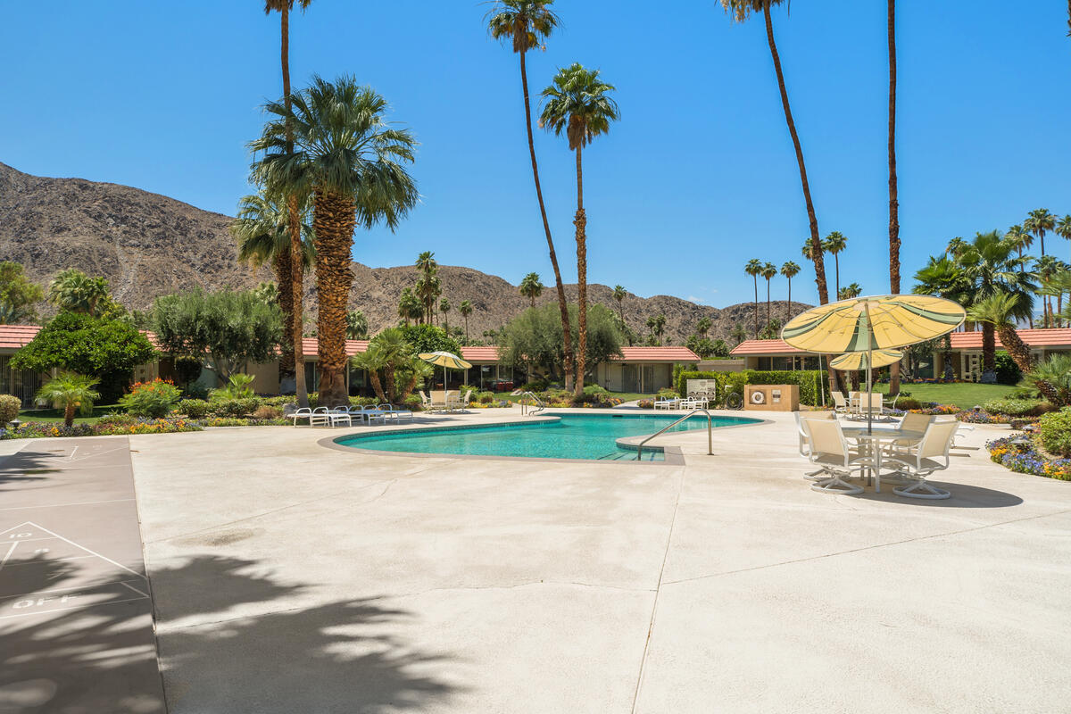 76895 Lark Drive Indian Wells, CA 92210 - Photo 3 of 25 a view of swimming pool with outdoor seating and plants