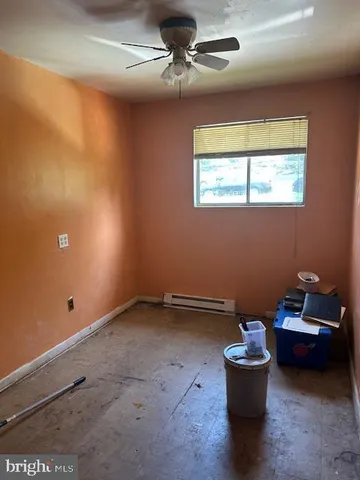 a view of a room with toys and wooden floor