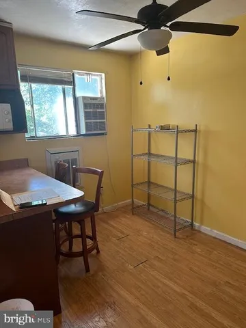 a view of a room with furniture and window