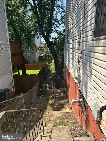 a balcony with trees in front of it