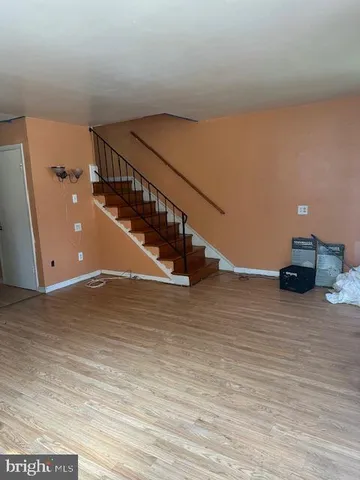a view of a room with wooden floor