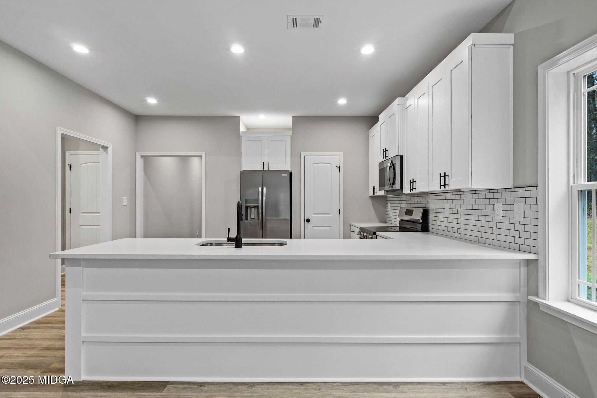 2760 Boxankle Road Forsyth, GA 31029 - Photo 12 of 50 a bathroom with a sink a shower and a mirror