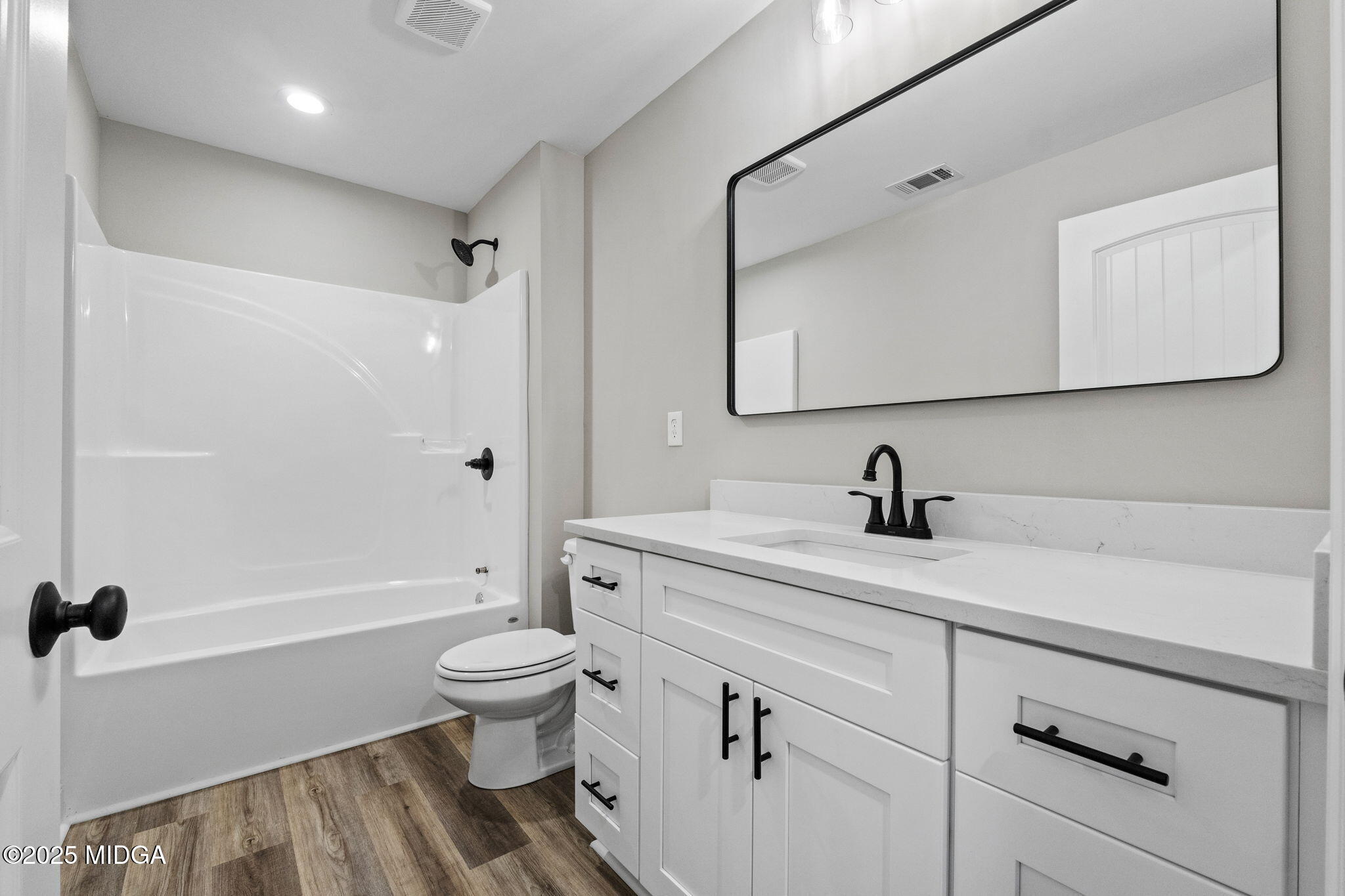 2760 Boxankle Road Forsyth, GA 31029 - Photo 33 of 50 a bathroom with a sink a toilet and a large mirror