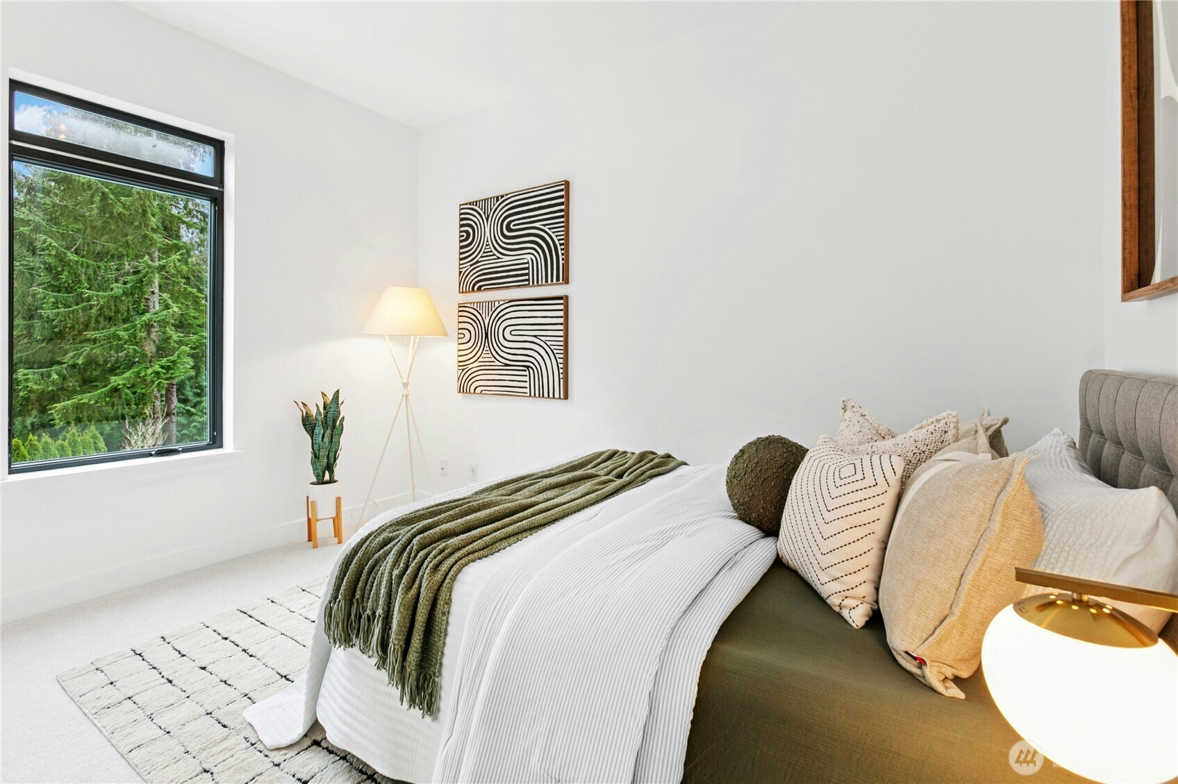 2115 Squak Mountain Loop Southwest Issaquah, WA 98027 - Photo 30 of 40 a bedroom with a bed and a window