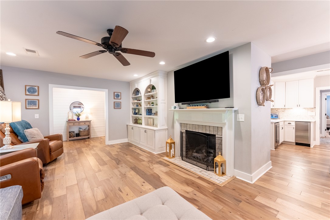 103 Riggs Drive Clemson, SC 29631 - Photo 4 of 50 Elegant built-in shelving flanks a cozy fireplace, setting a refined tone for this inviting living space.