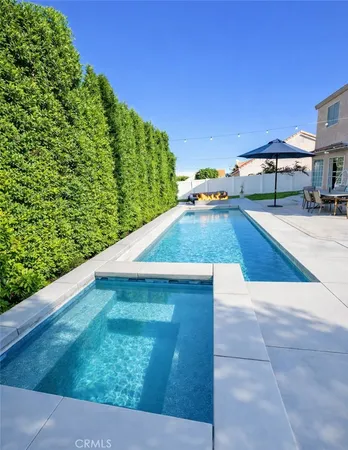 a view of a swimming pool with an outdoor seating