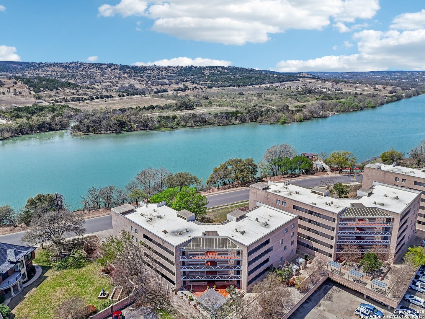 an aerial view of a house with a lake view