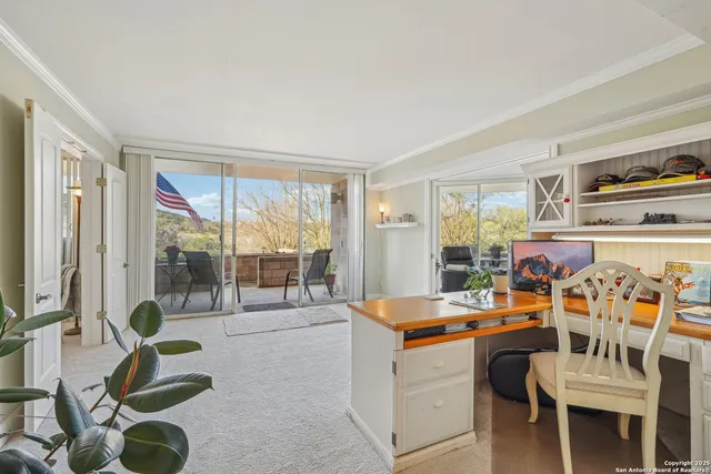 a room with furniture a flat screen tv and a large window