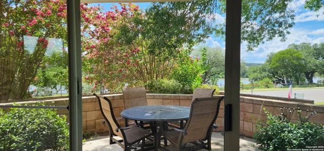 a view of a table and chairs in the patio