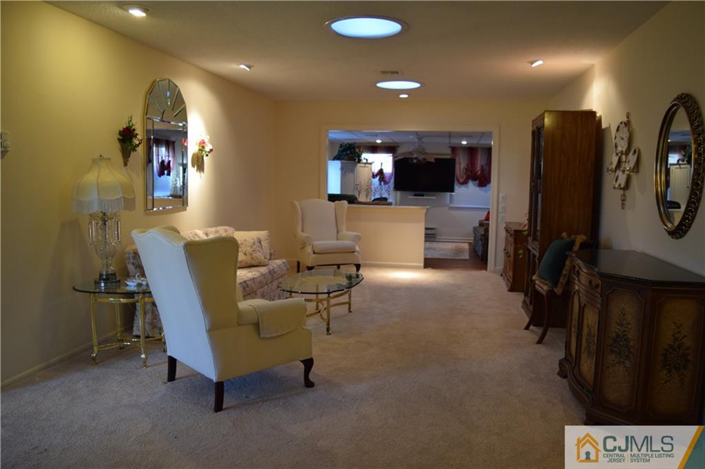274 A Convent Road Monroe Township, NJ 08831 - Photo 3 of 12 a living room with furniture and a flat screen tv