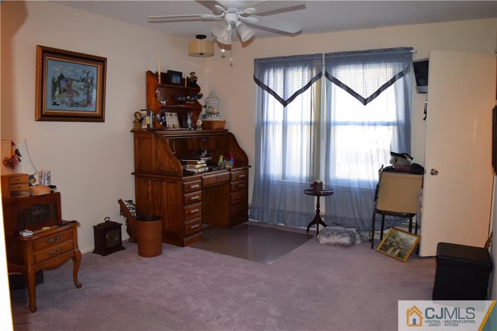 274 A Convent Road Monroe Township, NJ 08831 - Photo 10 of 12 a view of a workspace with furniture and a window