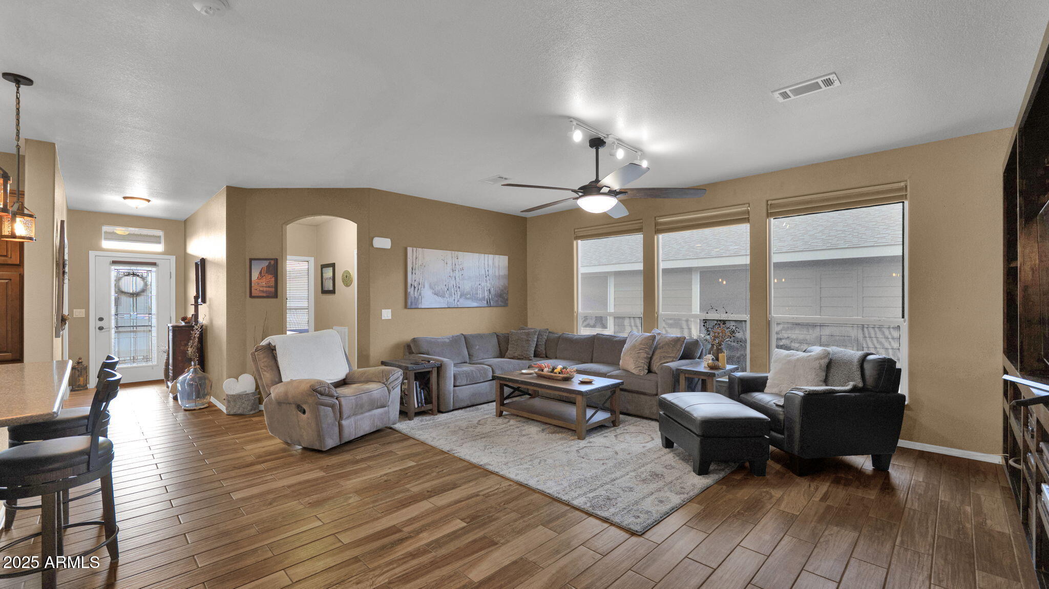 3301 South Goldfield Road, Unit 6014 Apache Junction, AZ 85119 - Photo 10 of 57 a living room with furniture and a large window