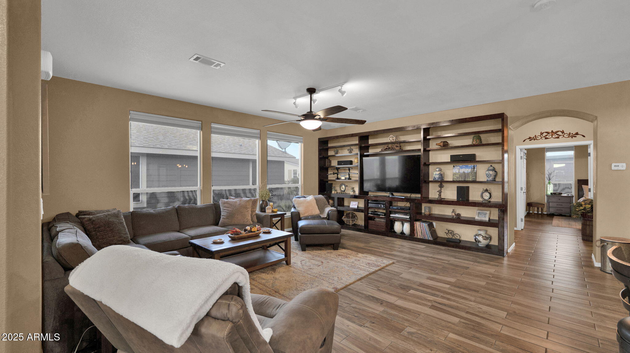 3301 South Goldfield Road, Unit 6014 Apache Junction, AZ 85119 - Photo 11 of 57 a living room with furniture and a flat screen tv
