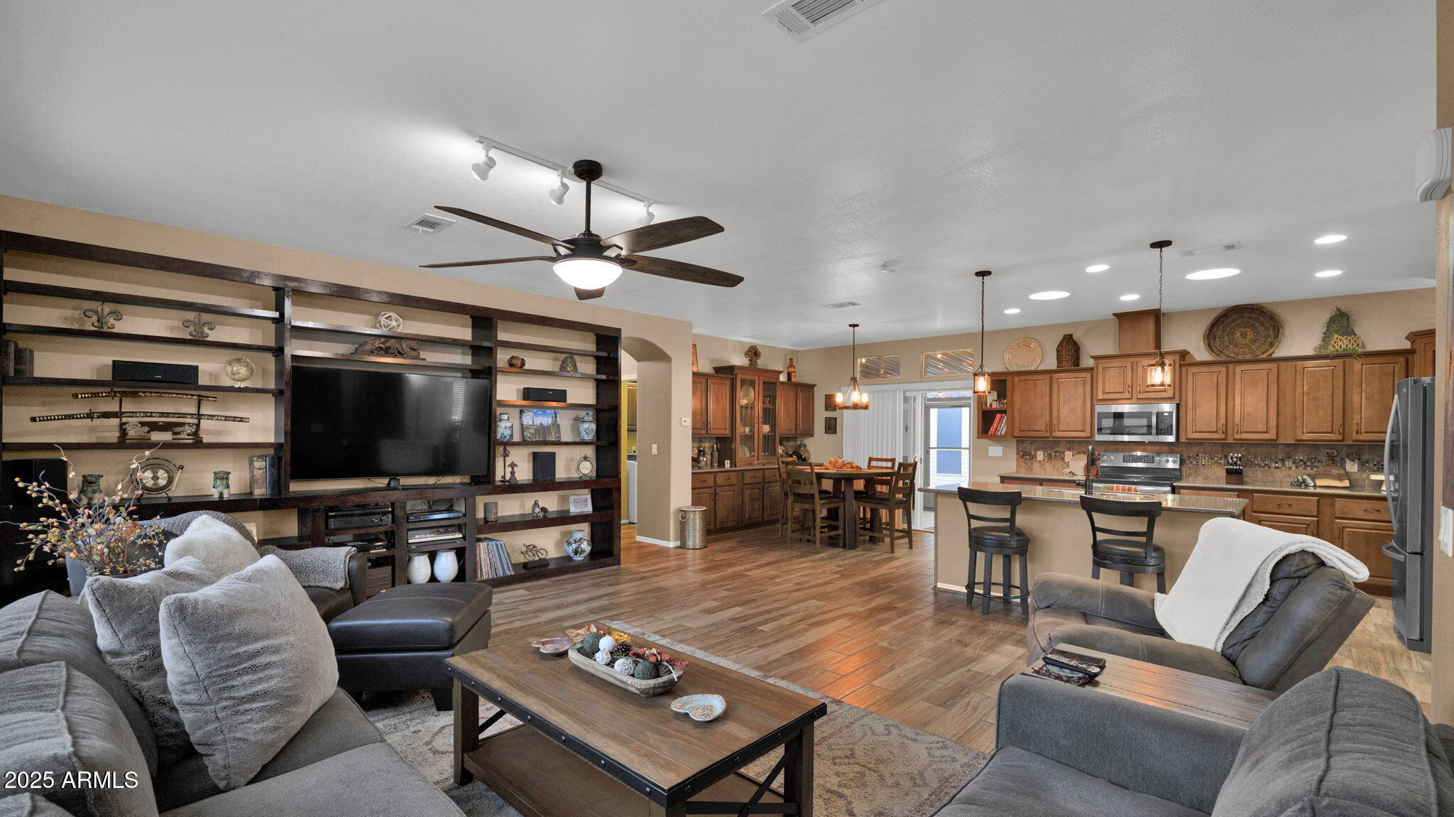 3301 South Goldfield Road, Unit 6014 Apache Junction, AZ 85119 - Photo 12 of 57 a living room with furniture and a flat screen tv