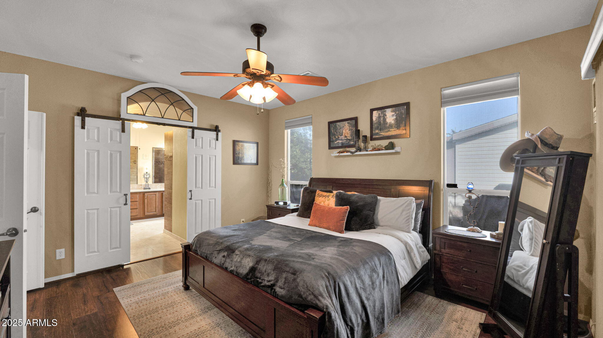 3301 South Goldfield Road, Unit 6014 Apache Junction, AZ 85119 - Photo 17 of 57 a bedroom with a bed and wooden floor