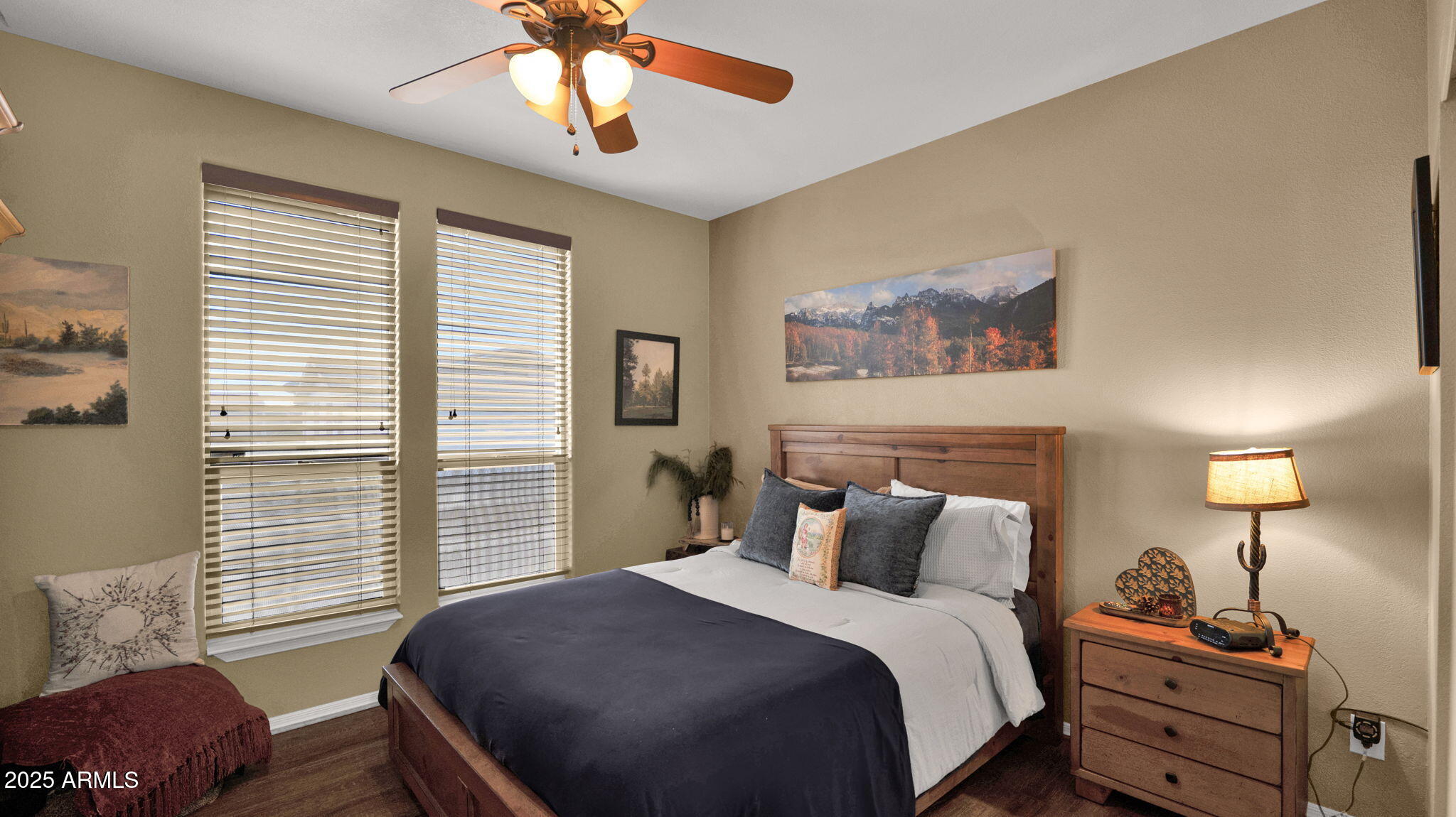 3301 South Goldfield Road, Unit 6014 Apache Junction, AZ 85119 - Photo 23 of 57 a bedroom with a bed and a chandelier