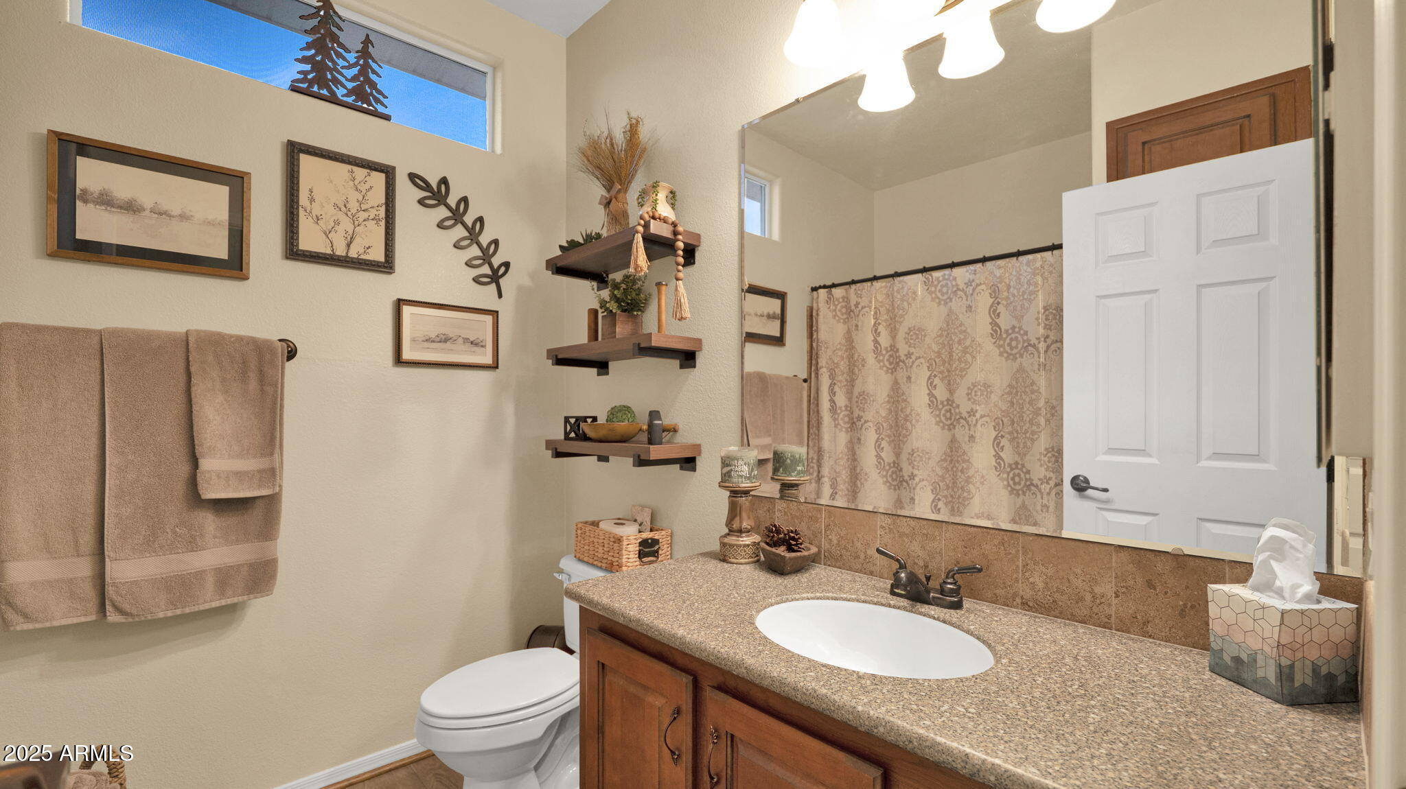 3301 South Goldfield Road, Unit 6014 Apache Junction, AZ 85119 - Photo 24 of 57 a bathroom with a granite countertop sink toilet and a mirror