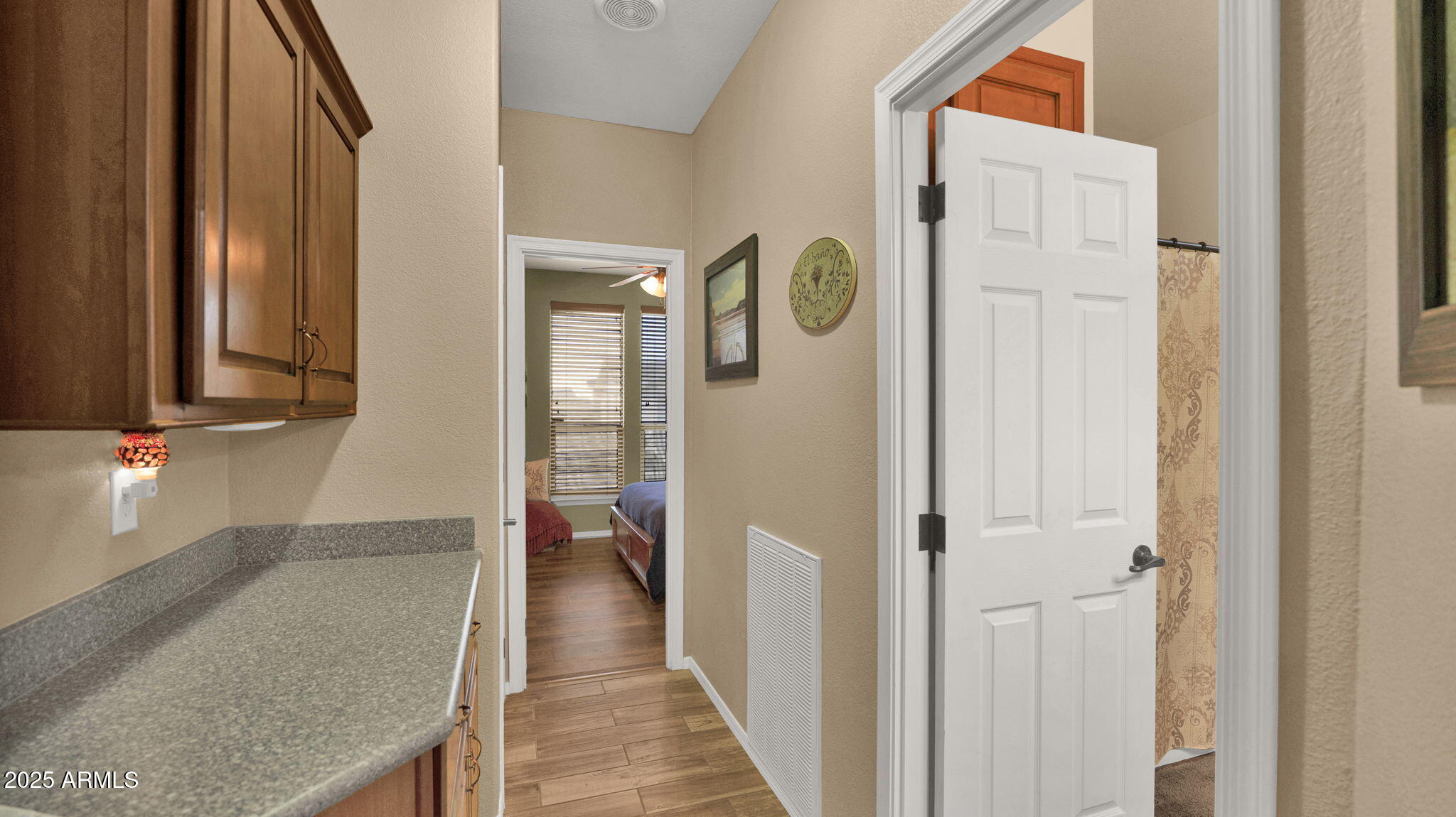 3301 South Goldfield Road, Unit 6014 Apache Junction, AZ 85119 - Photo 28 of 57 a view of a hallway with wooden floor and staircase