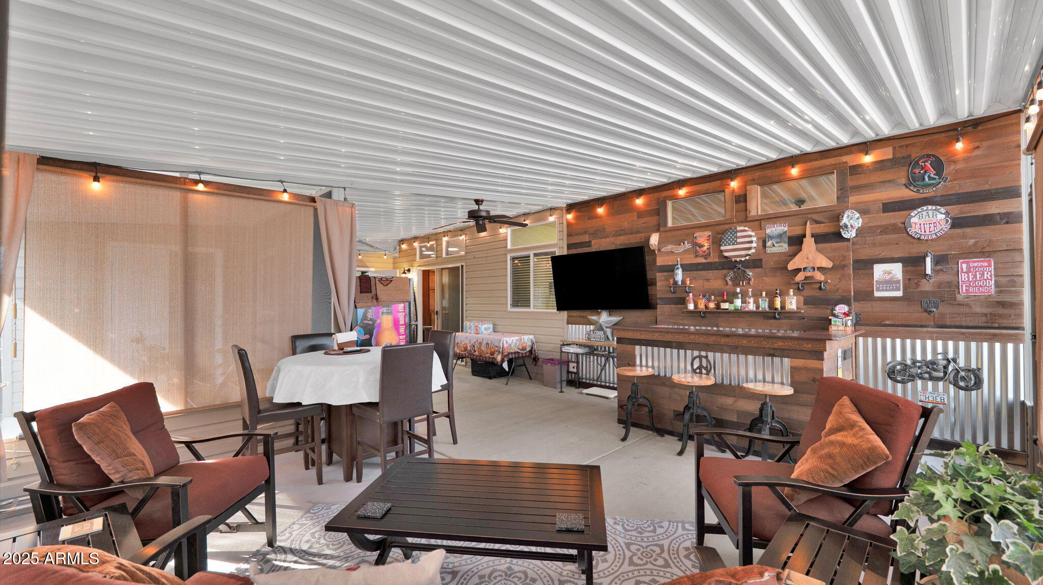 3301 South Goldfield Road, Unit 6014 Apache Junction, AZ 85119 - Photo 32 of 57 a outdoor living space with furniture and a fireplace