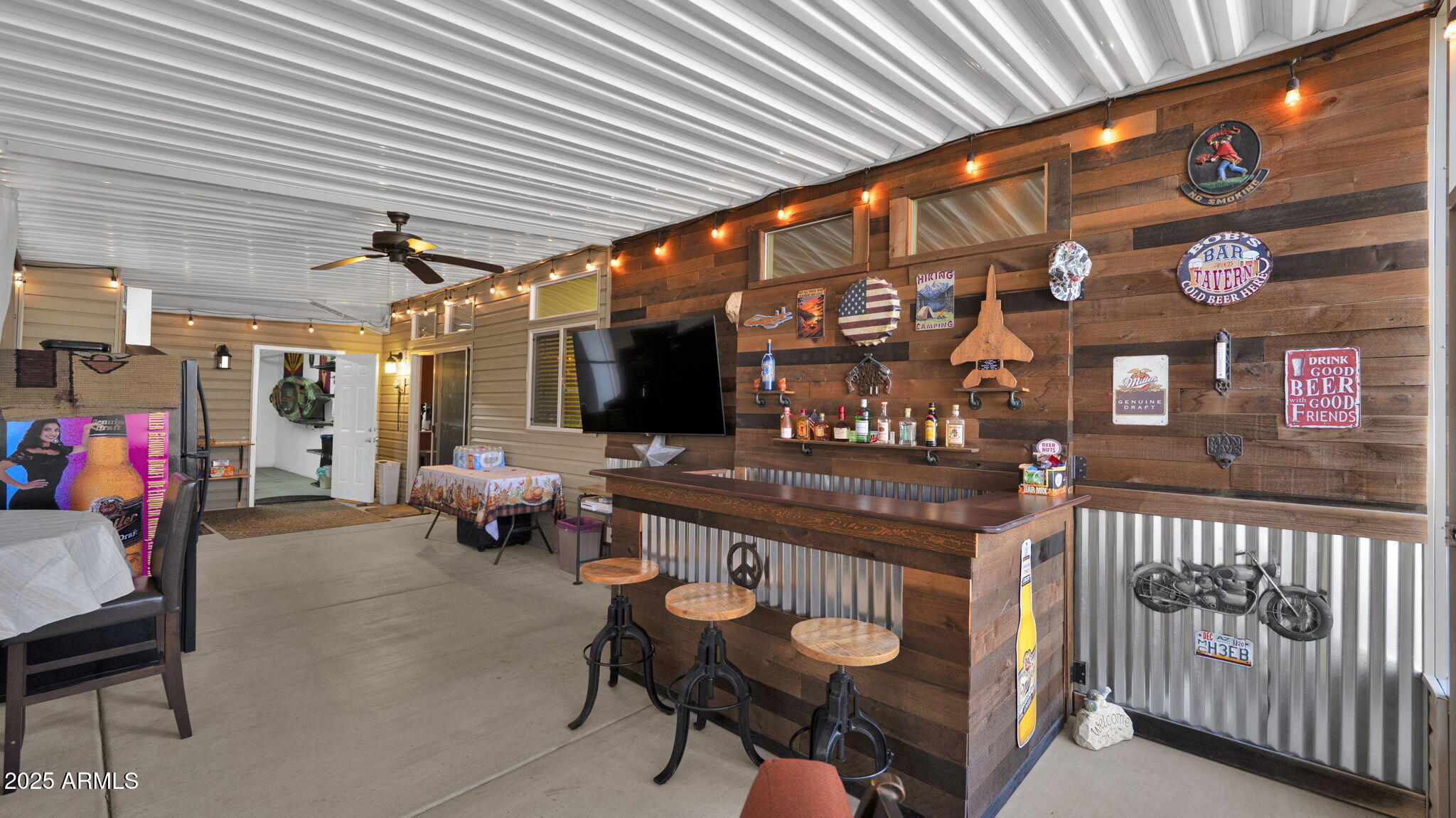 3301 South Goldfield Road, Unit 6014 Apache Junction, AZ 85119 - Photo 34 of 57 a view of a chairs and table in a patio