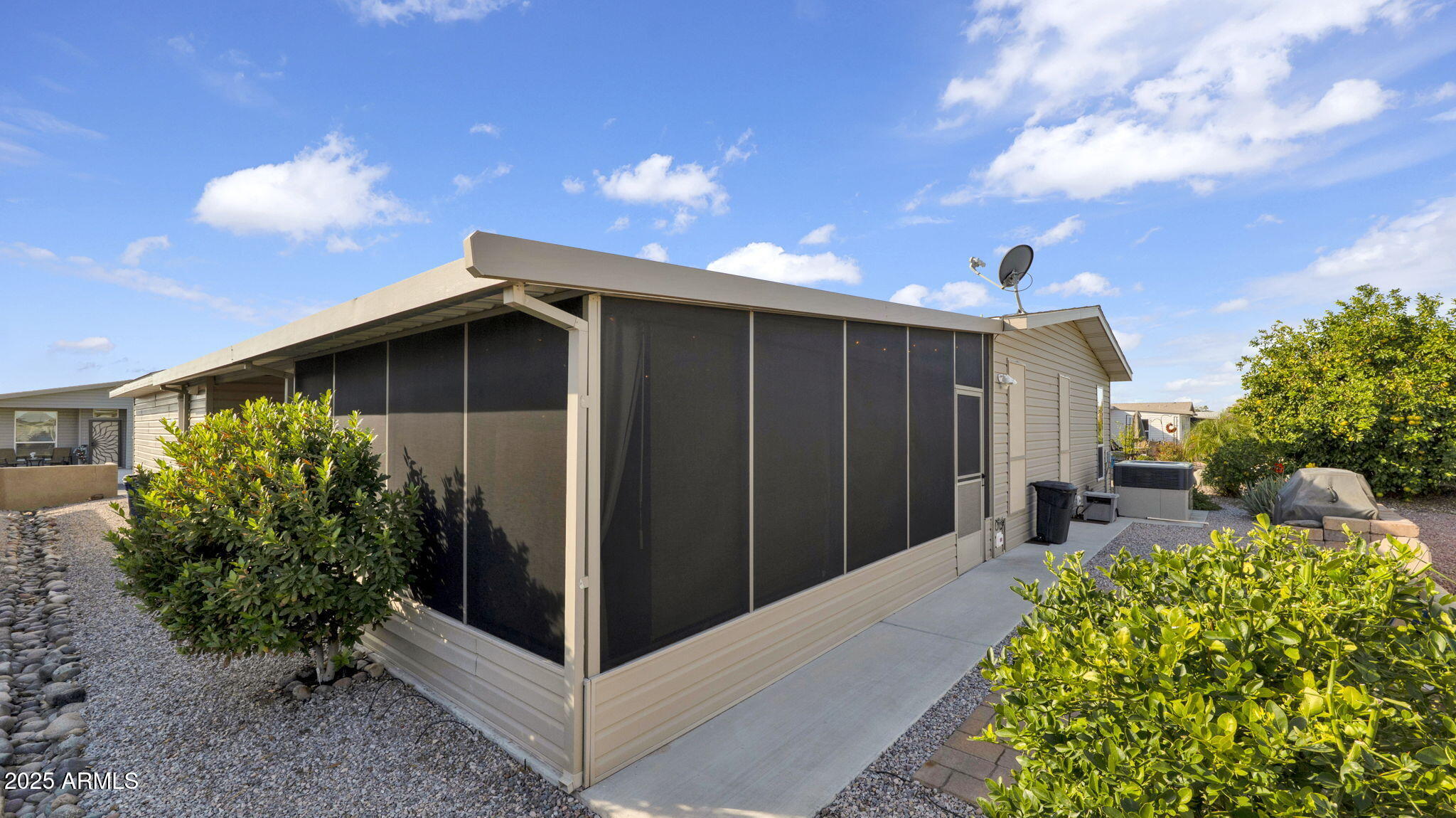 3301 South Goldfield Road, Unit 6014 Apache Junction, AZ 85119 - Photo 35 of 57 a front view of a house with garden