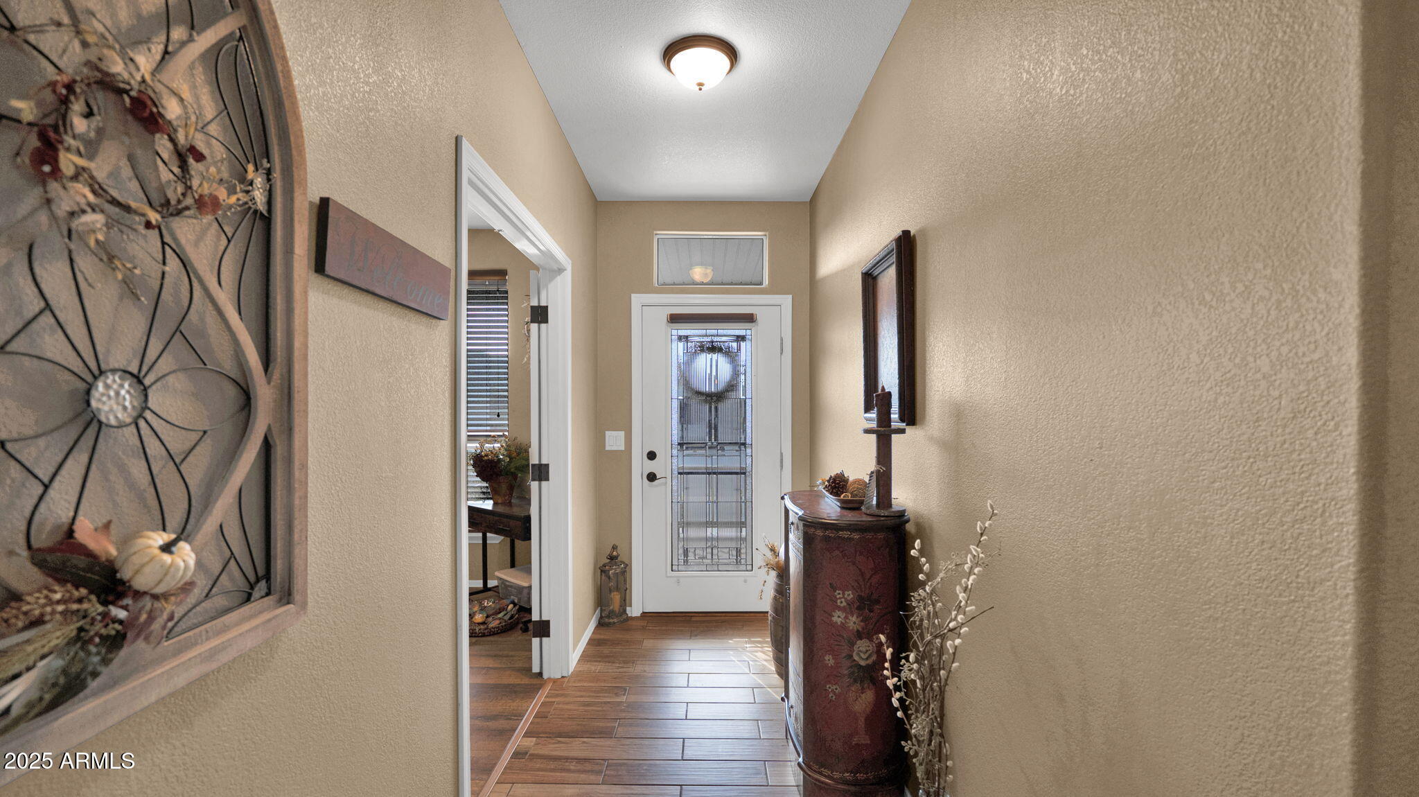 3301 South Goldfield Road, Unit 6014 Apache Junction, AZ 85119 - Photo 3 of 57 a view of hallway with wooden floor and stairs