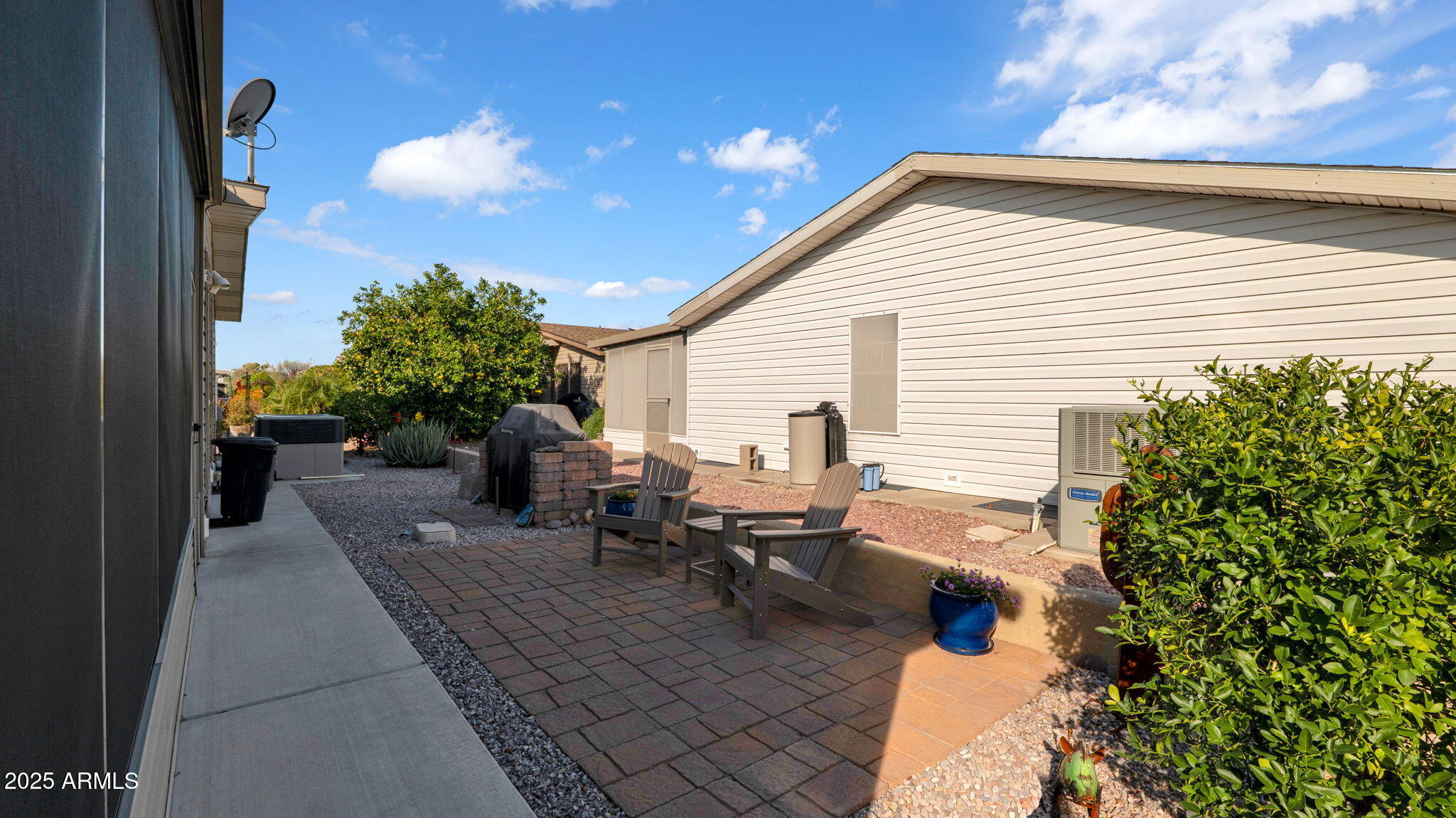 3301 South Goldfield Road, Unit 6014 Apache Junction, AZ 85119 - Photo 40 of 57 a view of a patio with table and chairs and potted plants
