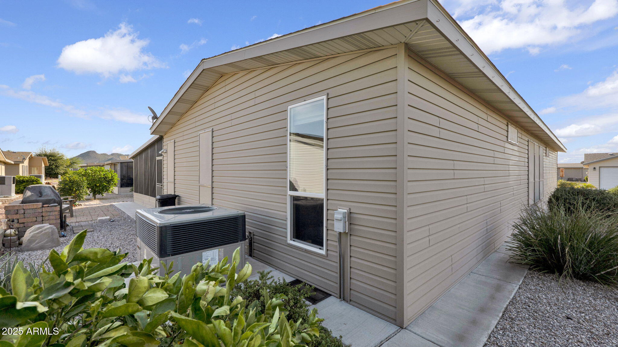 3301 South Goldfield Road, Unit 6014 Apache Junction, AZ 85119 - Photo 41 of 57 a view of backyard with sitting area
