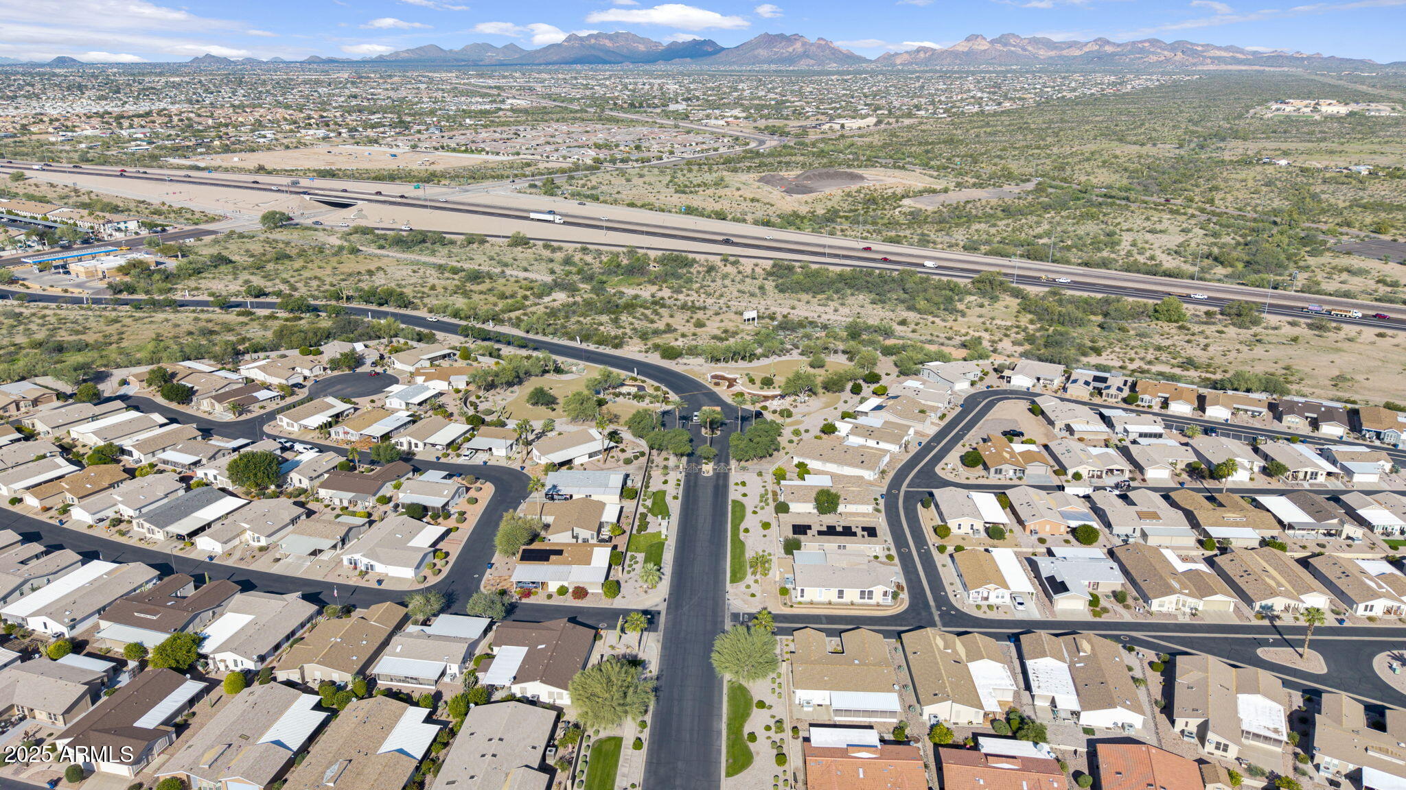 3301 South Goldfield Road, Unit 6014 Apache Junction, AZ 85119 - Photo 54 of 57 a view of a city with a mountain