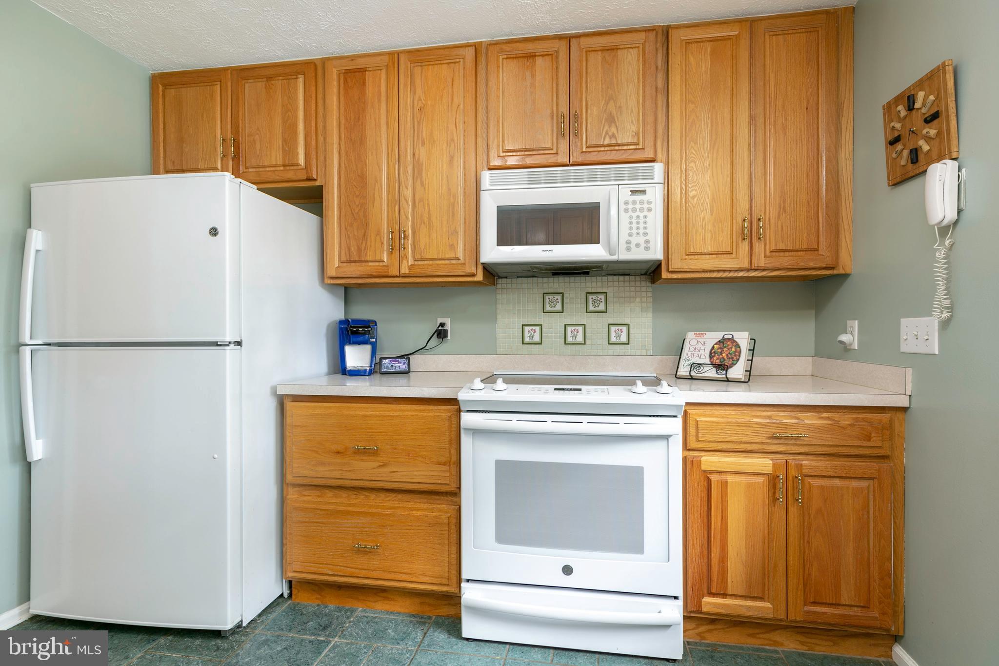105 Rutledge Road Queenstown, MD 21658 - Photo 14 of 57 New Smooth Cooktop Range, Microwave & Refrigerator